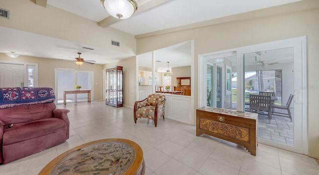 4308 Kingston Loop, Sarasota, FL 34238 - living room featuring a ceiling fan, healthy amount of natural light, light tile patterned floors, and beamed ceiling