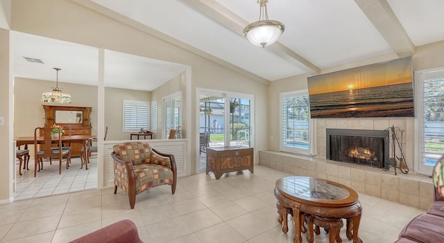 4308 Kingston Loop, Sarasota, FL 34238 - living room with a tiled fireplace, healthy amount of natural light, light tile patterned floors, and a wainscoted wall