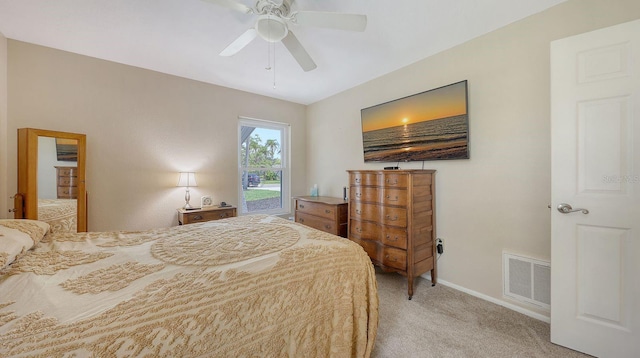 4308 Kingston Loop, Sarasota, FL 34238 - bedroom featuring light colored carpet, baseboards, and a ceiling fan