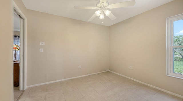 4308 Kingston Loop, Sarasota, FL 34238 - empty room featuring healthy amount of natural light, baseboards, and ceiling fan