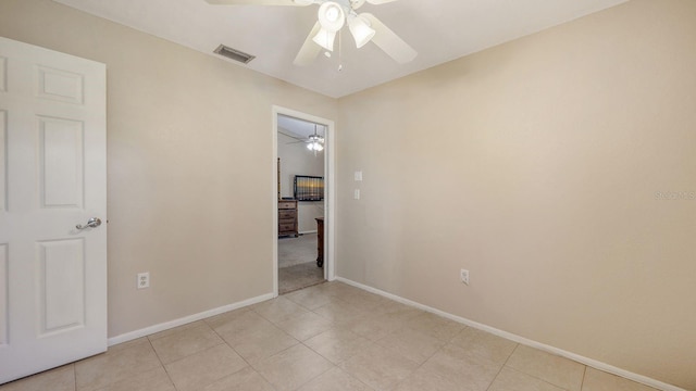 4308 Kingston Loop, Sarasota, FL 34238 - unfurnished bedroom with baseboards, ceiling fan, and light tile patterned flooring