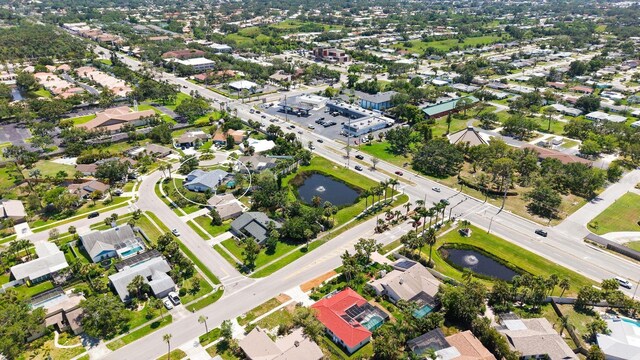 4308 Kingston Loop, Sarasota, FL 34238 - aerial view of property and surrounding area with a nearby body of water and nearby suburban area