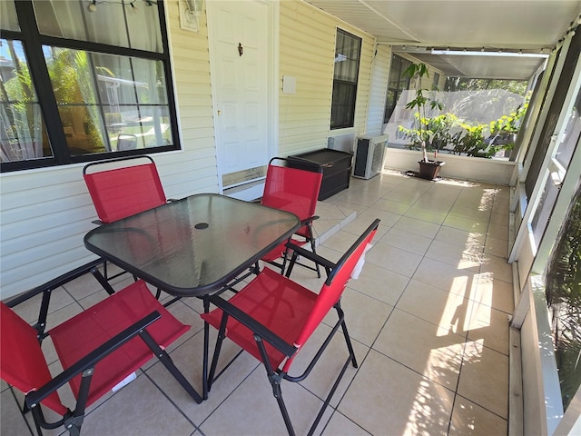 4213 E Michigan St Unit 4213, Orlando, FL 32812 - sunroom with outdoor dining space