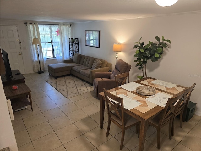 4213 E Michigan St Unit 4213, Orlando, FL 32812 - dining room featuring light tile patterned floors and crown molding