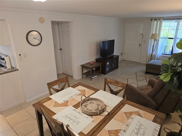 4213 E Michigan St Unit 4213, Orlando, FL 32812 - dining room featuring light tile patterned floors and crown molding