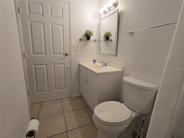 4213 E Michigan St Unit 4213, Orlando, FL 32812 - bathroom featuring vanity, tile patterned flooring, and toilet