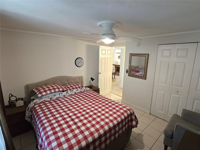 4213 E Michigan St Unit 4213, Orlando, FL 32812 - bedroom featuring light tile patterned floors, crown molding, a closet, and a ceiling fan