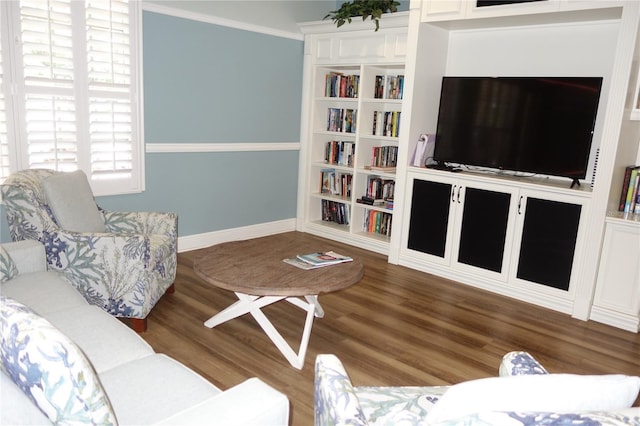 4204 Overture Cir # 4204, Bradenton, FL 34209 - living room featuring wood finished floors, crown molding, and built in features