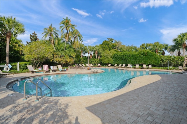 4204 Overture Cir # 4204, Bradenton, FL 34209 - community pool featuring a patio area and view of wooded area