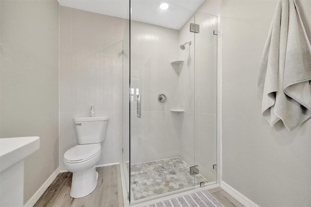 9822 Desoto Ct, Bradenton, FL 34210 - full bath featuring toilet, a stall shower, and wood finished floors