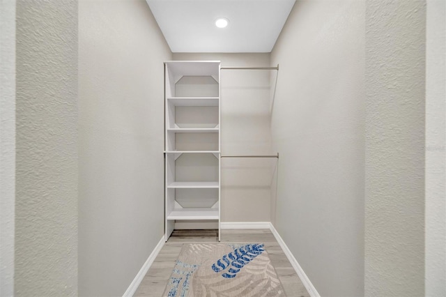 9822 Desoto Ct, Bradenton, FL 34210 - spacious closet featuring wood finished floors