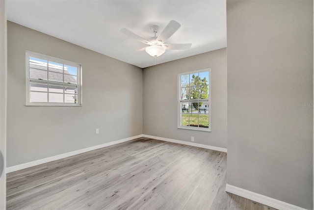 9822 Desoto Ct, Bradenton, FL 34210 - unfurnished room featuring wood finished floors, baseboards, and ceiling fan