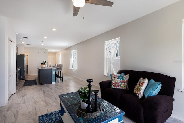 4739 Reisswood Loop, Palmetto, FL 34221 - living room with a ceiling fan, baseboards, and recessed lighting