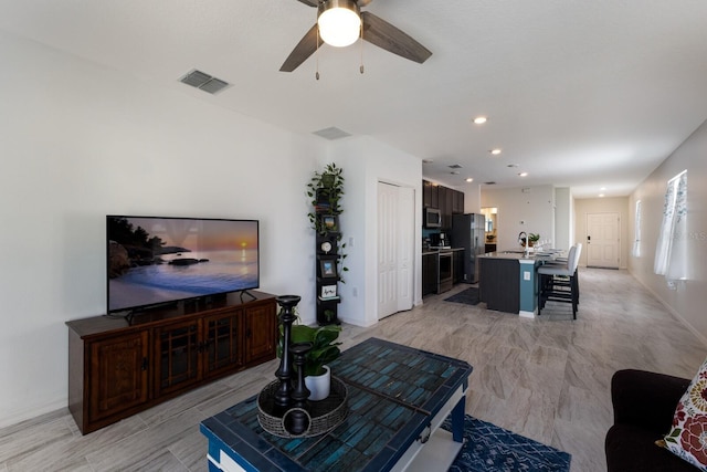 4739 Reisswood Loop, Palmetto, FL 34221 - living area with a ceiling fan and baseboards