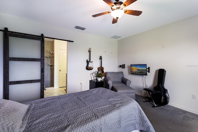 4739 Reisswood Loop, Palmetto, FL 34221 - carpeted bedroom featuring a barn door, baseboards, and ceiling fan