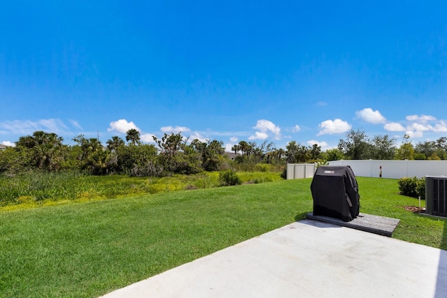 4739 Reisswood Loop, Palmetto, FL 34221 - view of yard featuring a patio and central air condition unit