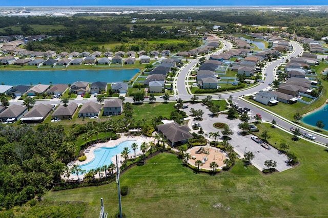 4739 Reisswood Loop, Palmetto, FL 34221 - aerial overview of property's location with nearby suburban area, a nearby body of water, and a pool