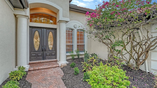 6914 Dominion Ln, Lakewood Ranch, FL 34202 - view of exterior entry with stucco siding