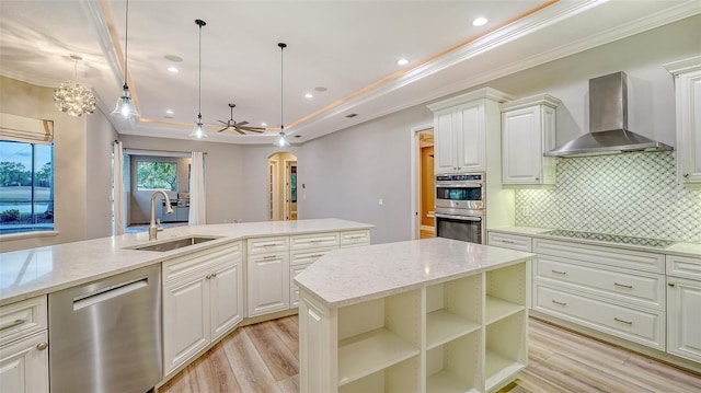 6914 Dominion Ln, Lakewood Ranch, FL 34202 - kitchen with wall chimney exhaust hood, appliances with stainless steel finishes, a sink, crown molding, and arched walkways
