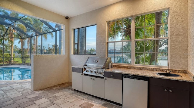 6914 Dominion Ln, Lakewood Ranch, FL 34202 - view of patio featuring a sink, a lanai, and an outdoor pool