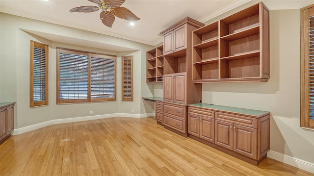 6914 Dominion Ln, Lakewood Ranch, FL 34202 - unfurnished office with light wood-style flooring, a ceiling fan, built in study area, baseboards, and ornamental molding