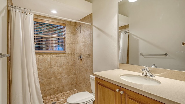 6914 Dominion Ln, Lakewood Ranch, FL 34202 - full bathroom with vanity, toilet, and a tile shower