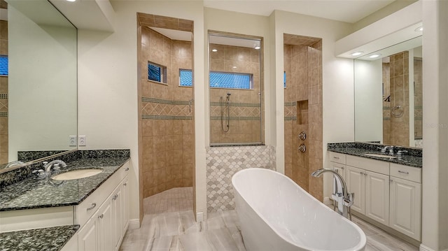 6914 Dominion Ln, Lakewood Ranch, FL 34202 - full bathroom with a freestanding bath, walk in shower, two vanities, and recessed lighting