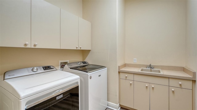 6914 Dominion Ln, Lakewood Ranch, FL 34202 - laundry area featuring cabinet space, washer and dryer, and wood finished floors