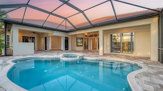 6914 Dominion Ln, Lakewood Ranch, FL 34202 - view of pool featuring a ceiling fan, a patio area, a pool with connected hot tub, and glass enclosure