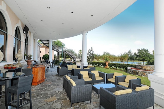 6914 Dominion Ln, Lakewood Ranch, FL 34202 - view of patio featuring stairway, outdoor dining space, a water view, and an outdoor hangout area