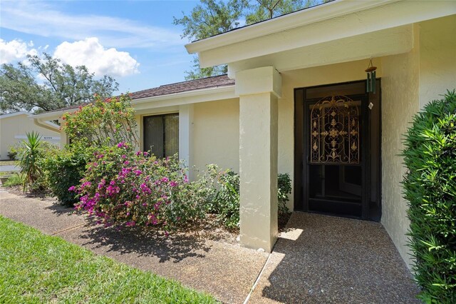 4109 Carriage Dr Unit 23, Sarasota, FL 34241 - entrance to property featuring stucco siding
