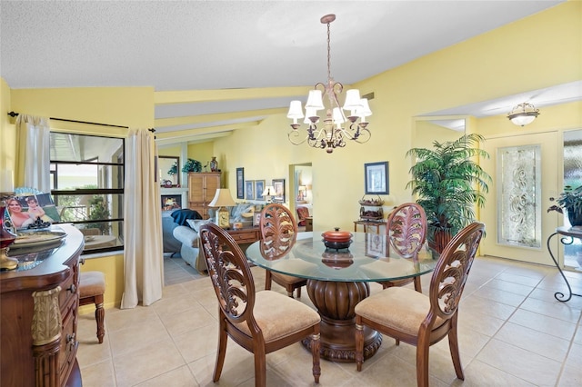 4109 Carriage Dr Unit 23, Sarasota, FL 34241 - dining space with light tile patterned flooring and a chandelier