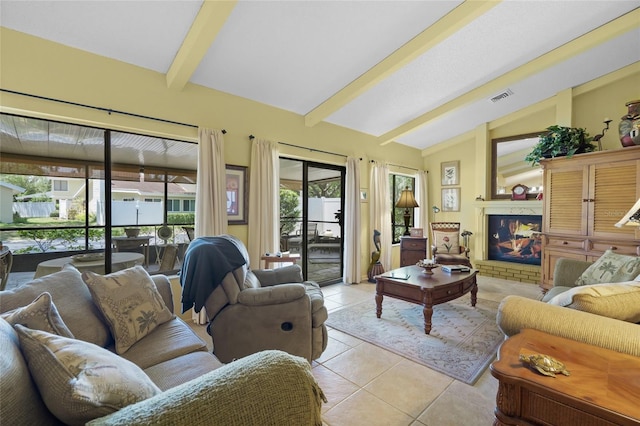 4109 Carriage Dr Unit 23, Sarasota, FL 34241 - living area with light tile patterned floors and a fireplace