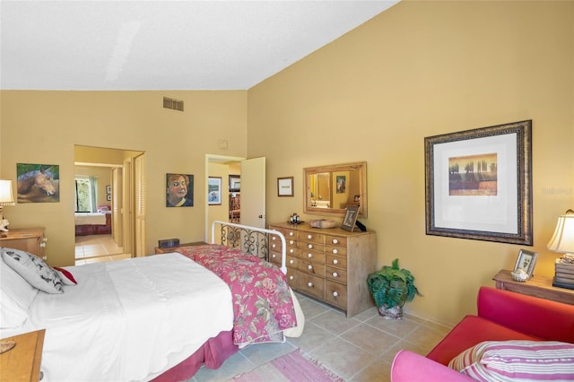 4109 Carriage Dr Unit 23, Sarasota, FL 34241 - tiled bedroom with high vaulted ceiling and ensuite bath
