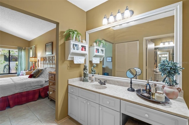 4109 Carriage Dr Unit 23, Sarasota, FL 34241 - ensuite bathroom with tile patterned flooring, lofted ceiling, vanity, and a closet