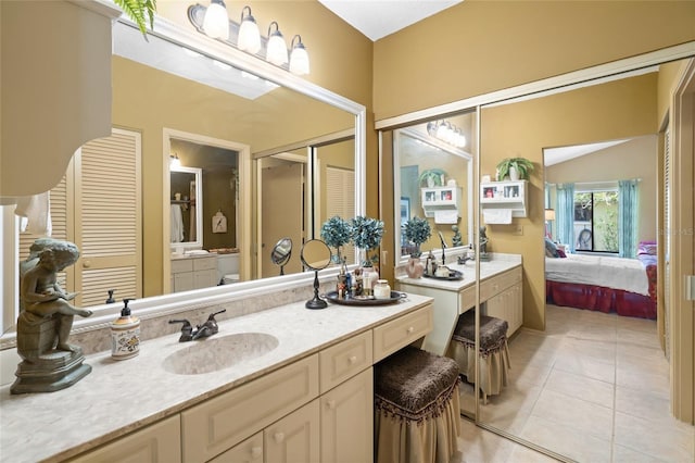 4109 Carriage Dr Unit 23, Sarasota, FL 34241 - bathroom with vanity, tile patterned floors, and connected bathroom