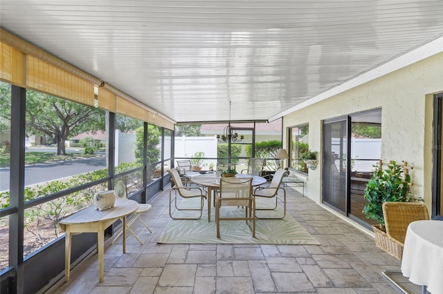 4109 Carriage Dr Unit 23, Sarasota, FL 34241 - sunroom with outdoor dining space