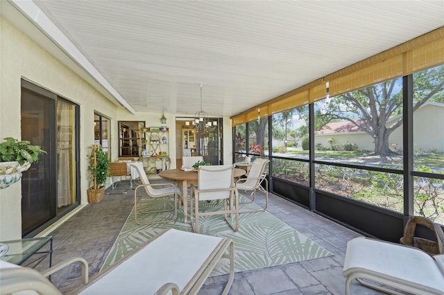 4109 Carriage Dr Unit 23, Sarasota, FL 34241 - sunroom / solarium featuring a chandelier