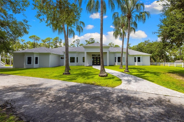 7051 Turtle Ln, Sarasota, FL 34241 - view of front of house with stucco siding and french doors