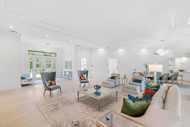 7051 Turtle Ln, Sarasota, FL 34241 - living room with light wood-type flooring, recessed lighting, and french doors