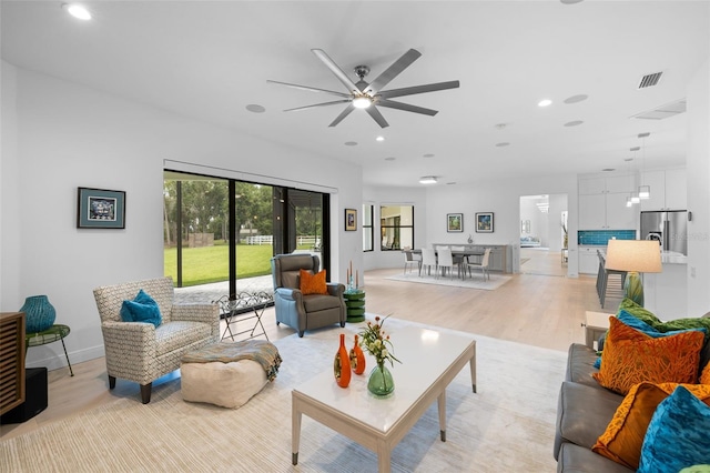 7051 Turtle Ln, Sarasota, FL 34241 - living room with light wood finished floors, recessed lighting, and ceiling fan