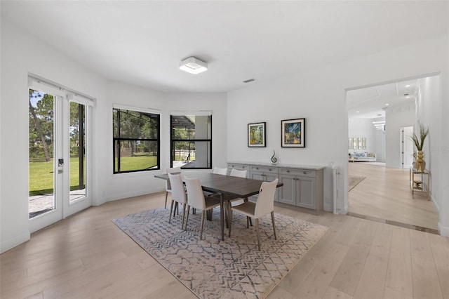 7051 Turtle Ln, Sarasota, FL 34241 - dining space with light wood-style floors