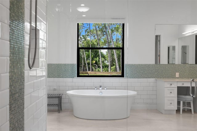 7051 Turtle Ln, Sarasota, FL 34241 - full bath with a freestanding bath, tile walls, and vanity