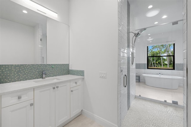 7051 Turtle Ln, Sarasota, FL 34241 - bathroom with vanity, a freestanding tub, a shower stall, recessed lighting, and tile walls