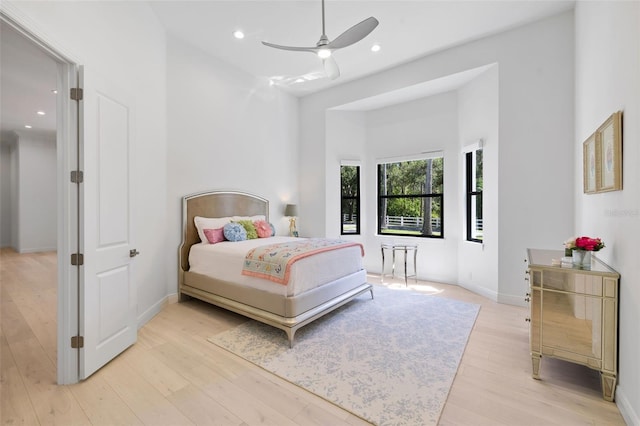 7051 Turtle Ln, Sarasota, FL 34241 - bedroom featuring light wood-style floors, recessed lighting, a high ceiling, and a ceiling fan
