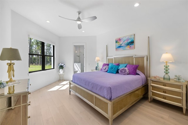 7051 Turtle Ln, Sarasota, FL 34241 - bedroom with wood finished floors, ensuite bathroom, recessed lighting, and ceiling fan