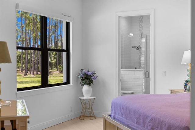 7051 Turtle Ln, Sarasota, FL 34241 - bedroom with ensuite bath and light wood finished floors
