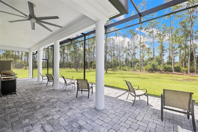 7051 Turtle Ln, Sarasota, FL 34241 - sunroom with a ceiling fan and view of wooded area
