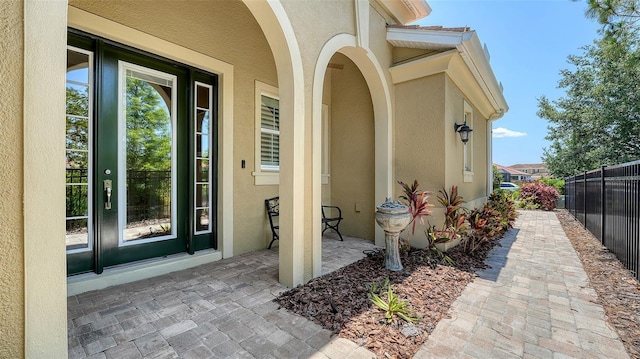 11603 Bluebird Pl, Lakewood Ranch, FL 34211 - doorway to property featuring stucco siding