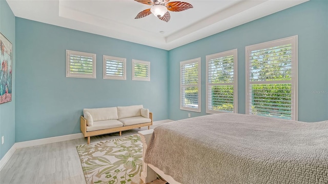 11603 Bluebird Pl, Lakewood Ranch, FL 34211 - bedroom with baseboards, ceiling fan, and a raised ceiling